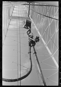 Traveling block and derrick against the sky, Seminole, Oklahoma by Russell Lee