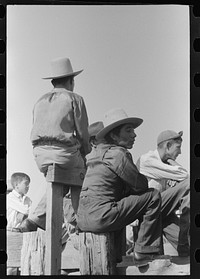 Spanish-American family waiting at the gate at Bean Day rodeo, Wagon Mound, New Mexico by Russell Lee
