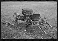Old buggy and pitchfork on farm near Northampton, Massachusetts by Russell Lee