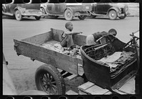 [Untitled photo, possibly related to: Sign and battery on 's truck, Waco, Texas] by Russell Lee