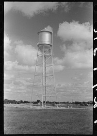 Water tower at migrant camp under construction at Sinton, Texas by Russell Lee