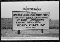 Sign showing various services rendered by service station, Waco, Texas by Russell Lee