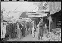 [Untitled photo, possibly related to: Saleswoman at grocery store, Waco, Texas] by Russell Lee