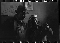 [Untitled photo, possibly related to: Pomp Hall, tenant farmer, talking to another farmer as he waits at the smith shop in Depew, Oklahoma for his plow points to be sharpened. Pomp Hall is considered one of the best farmers in this county and is consulted by African American and American concerning farming problems. See general caption number 23] by Russell Lee