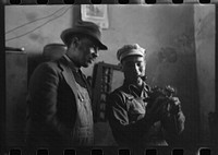[Untitled photo, possibly related to: Pomp Hall,  tenant farmer, talking to another farmer as he waits at the smith shop in Depew, Oklahoma for his plow points to be sharpened. Pomp Hall is considered one of the best farmers in this county and is consulted by Negroes and whites concerning farming problems. See general caption number 23] by Russell Lee