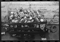 Oil cans at side of filling station, Eufaula, Oklahoma by Russell Lee