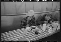 Cowboys eating breakfast at restaurant on the grounds of the San Angelo Fat Stock Show, San Angelo, Texas by Russell Lee