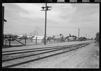 Tents used for dwellings near the railroad tracks in Phoenix, Arizona by Russell Lee