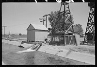 Deep water well that flows into the irrigation ditch. Irrigation is necessary for the raising of all crops in this section, Maricopa County, Arizona by Russell Lee