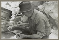 Panning gold. Pinos Altos, New Mexico by Russell Lee