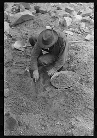 Pinos Altos, New Mexico. Gold prospector working his diggings by Russell Lee