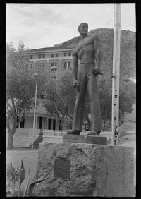 Miners monument in Bisbee, Arizona. This monument is cast in cement, sprayed with molten copper and mounted on a block of Colorado granite used for miners' drilling contests in the nineties. The monument was erected in 1935 by Russell Lee