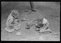 The Whinery children playing. Pie Town, New Mexico by Russell Lee