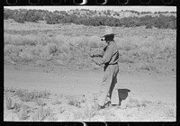 Water witch walks in the direction that stick heads him. Pie Town, New Mexico by Russell Lee