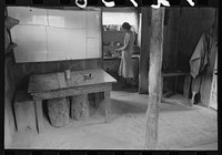 [Untitled photo, possibly related to: Woman in adobe house, Pie Town, New Mexico] by Russell Lee