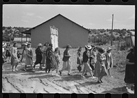 Procession of Spanish-American Catholics in honor of a saint, Penasco, New Mexico by Russell Lee