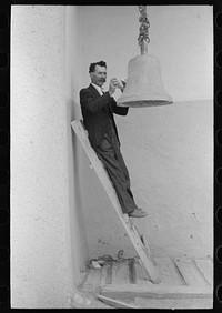 [Untitled photo, possibly related to: Spanish-American ringing bell with rock at the Church of the Twelve Apostles, Trampas, New Mexico. Church is 350 years old] by Russell Lee