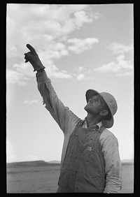 [Untitled photo, possibly related to: Mormon farmer working on FSA (Farm Security Administration) cooperative drill, Oneida County, Idaho. While the members of the cooperative live in Snowville, Utah, some of them farm in Oneida County, Idaho] by Russell Lee