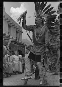 A member of the Forest Service who is participating in Indian dances at the fiesta, Taos, New Mexico by Russell Lee