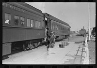 [Untitled photo, possibly related to: Passenger, alighting from morning train, Montrose, Colorado] by Russell Lee