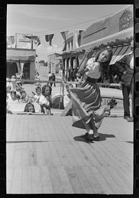Spanish-American girl in native dance. Fiesta at Taos, New Mexico by Russell Lee