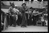 [Untitled photo, possibly related to: Spanish-American musicians at fiesta, Taos, New Mexico] by Russell Lee