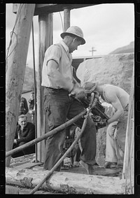 [Untitled photo, possibly related to: Miners in power drilling contest, Labor Day celebration, Silverton, Colorado] by Russell Lee