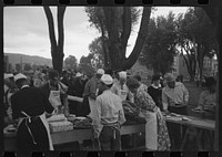[Untitled photo, possibly related to: Making barbecue sandwiches at the free barbecue on Labor Day, Ridgway, Colorado] by Russell Lee