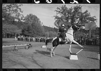 High school horse performs before children of construction workers at Summit City School, Summit City, California by Russell Lee