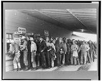 Construction workers lined up to be paid off, Shasta Dam, Shasta County, California by Russell Lee