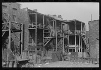 Back steps of apartments in  section of Chicago, Illinois by Russell Lee