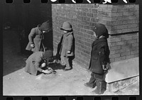 Where the  and white sections on the South Side meet, the white and Negro children sometimes play together, Chicago, Illinois by Russell Lee
