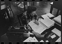 Employee in insurance company office, South Side of Chicago, Illinois by Russell Lee