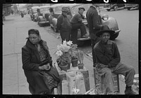 Selling Easter lilies on sidewalk on Easter morning, South Side of Chicago, Illinois by Russell Lee