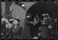 [Untitled photo, possibly related to: Shaking hands with members of the congregation after services at an Episcopal Church, South Side, Chicago, Illinois] by Russell Lee