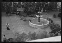 [Untitled photo, possibly related to: Playing shuffle board in courtyard of Hotel U.S. Grant. San Diego, California] by Russell Lee