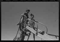 [Untitled photo, possibly related to: Children playing on slide at FSA (Farm Security Administration) labor camp, Caldwell, Idaho] by Russell Lee