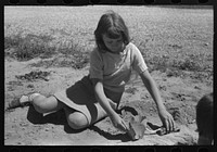 Child of a farm worker living at the FSA (Farm Security Administration) labor camp. Caldwell, Idaho by Russell Lee