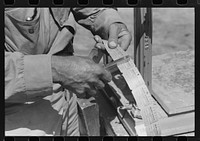 When you deliver a hamper of peas to the checker he gives you this check redeemable once a week. Labor contractor's pea pickers crew.  Nampa, Idaho. by Russell Lee