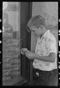 Schoolboy who collects match folders. Caldwell, Idaho by Russell Lee