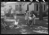 [Untitled photo, possibly related to: Caldwell, Idaho. Putting the deck chairs out on the shady lawn] by Russell Lee