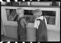 Little boys deciding what kind of candy they want to buy. Caldwell, Idaho by Russell Lee