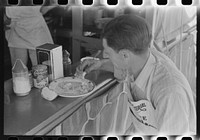 Lunch at carnival stand, Fourth of July, Vale, Oregon by Russell Lee