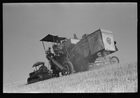 Walla Walla County, Washington. A combine in the wheat field by Russell Lee