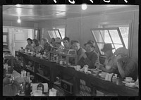 [Untitled photo, possibly related to: Men who work on mechanical hop picking machines have lunch at the company restaurant, Yakima Chief Hop Ranch, Yakima County, Washington] by Russell Lee