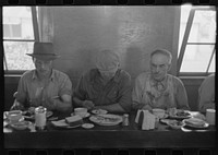 [Untitled photo, possibly related to: Men who work on mechanical hop picking machines have lunch at the company restaurant, Yakima Chief Hop Ranch, Yakima County, Washington] by Russell Lee