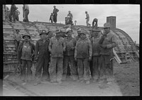 Workmen at Umatilla Ordnance Depot in front of igloo under construction, Hermiston, Oregon by Russell Lee