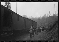 [Untitled photo, possibly related to: Lumberjacks get off the "crummies" when they arrive in the woods. Long Bell Lumber Company, Cowlitz County, Washington] by Russell Lee