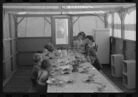Lunch for children at the FSA (Farm Security Administration)'s mobile camp for migratory farm workers, Odell, Oregon by Russell Lee