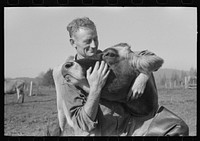 FSA (Farm Security Administration) rehabilitation borrower who is a dairy farmer with one of his cows, Tillamook County, Oregon by Russell Lee